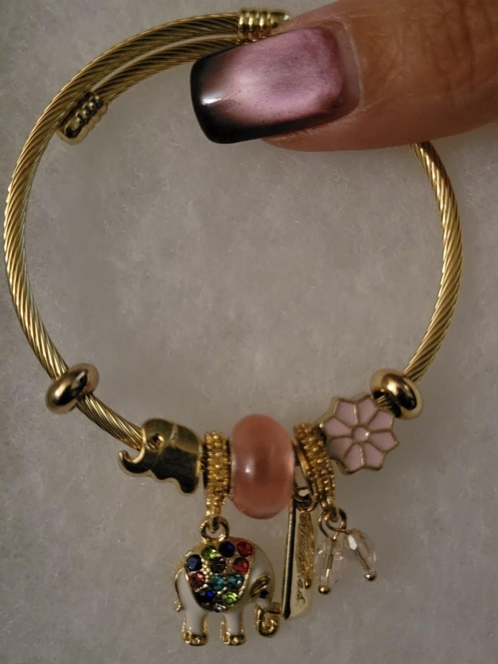 Gold-Tone Elephant Charm Bracelet with Pink Enamel Flower and Pink Bead